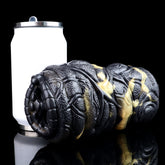 Vibrating dual-hole animal stroker with textured black snake body and gold accents