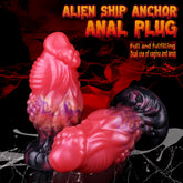 Pink alien-style anal plug, ribbed texture, black flared base, galaxy swirl pattern
