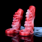 Fantasy penis sleeve with red tentacle-like texture and ridged head, sculpted details