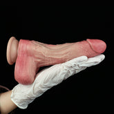 Pink realistic dildo with veining and rounded base, held by white glove.