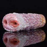 Canine fleshlight stroker in pink, ridged texture and open muzzle-style opening.