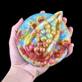 Rhea Fantasy Grinder toy—handheld glitter octopus-themed grinder with raised beads