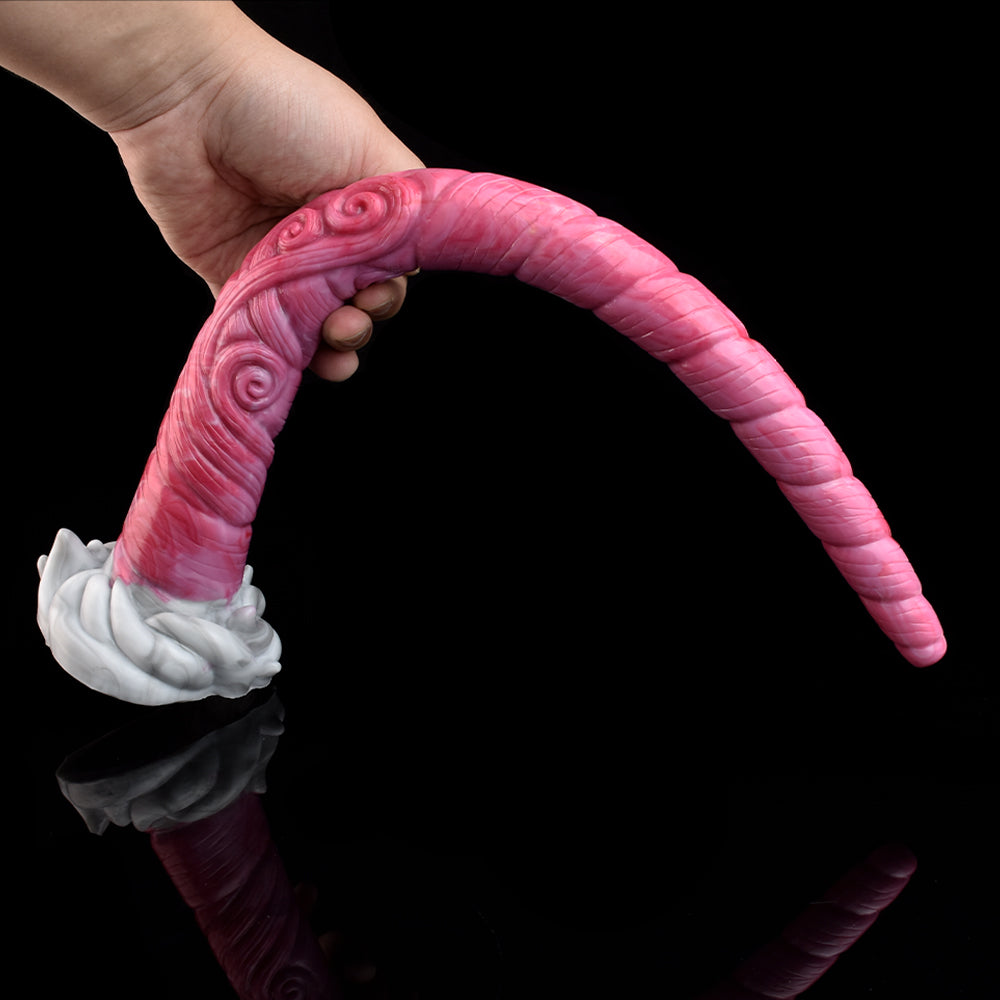 Pink long tentacle butt plug with spiral details and white flared base, held in hand