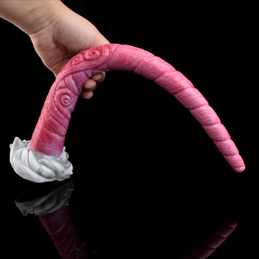 Pink spiral-ridged tentacle butt plug held near the white base, curved shape
