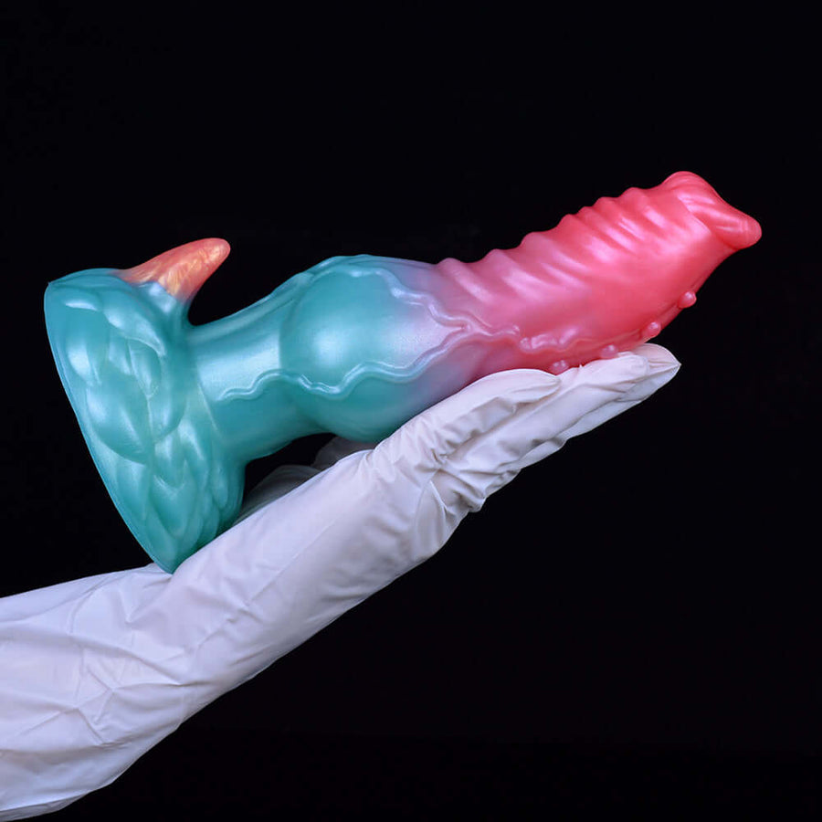 Adult novelty dildo with teal base and pink ridged tip, alien dog head shape