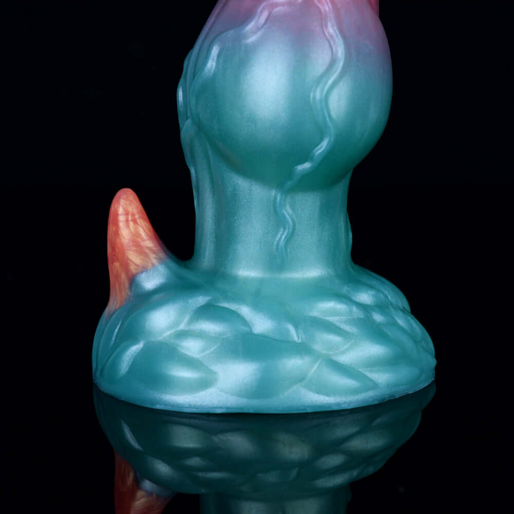 Blue knotted alien base with textured ridges and pink side horn, monster dog dildo
