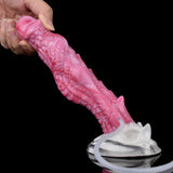 Rosafarbener Dildo-Spitze mit Drachenrelief, Handgriff, weiße Saugbasis und Schlauch