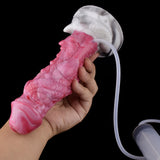 Rosafarbener Drachen-Dildo in Hand, gebogener Körper mit Saugbasis und Schlauch