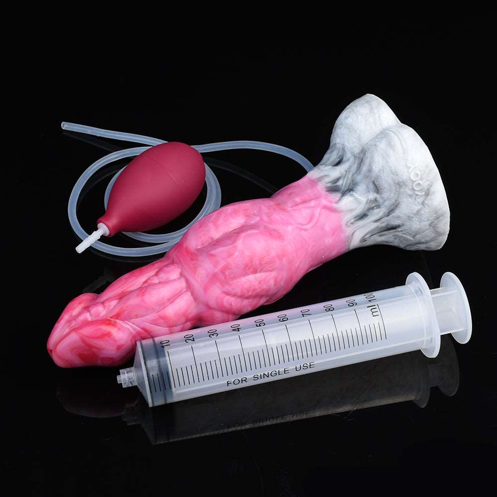 Pink monster-shaped vibrator with grey textured head and maroon control bulb