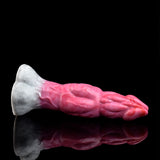 Pink translucent monster vibrator side view with huge knot, mirrored on dark surface