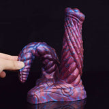 Suction-cup base and ribbed twin ends of marbled purple-blue dildo