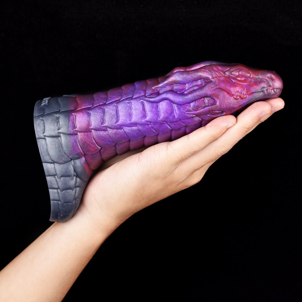 Purple scaly dragon sheath sleeve with navy textured underside; held in a hand