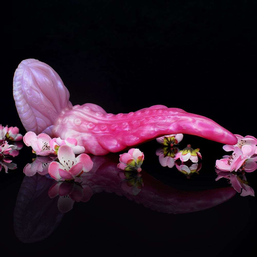 Pink curved octopus-shaped dildo, glossy with tentacle details