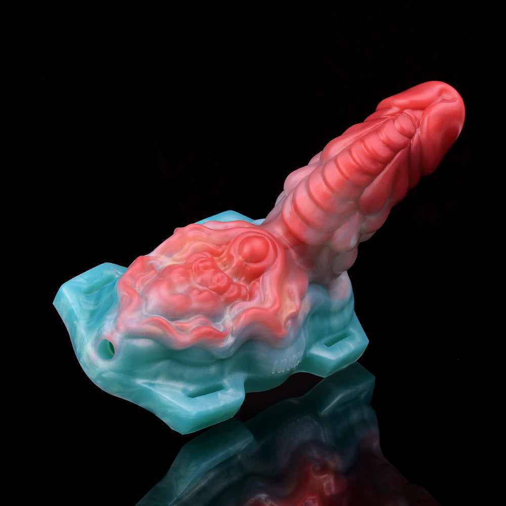 Aida humping dragon vibrating toy, side view with red head and blue molded base