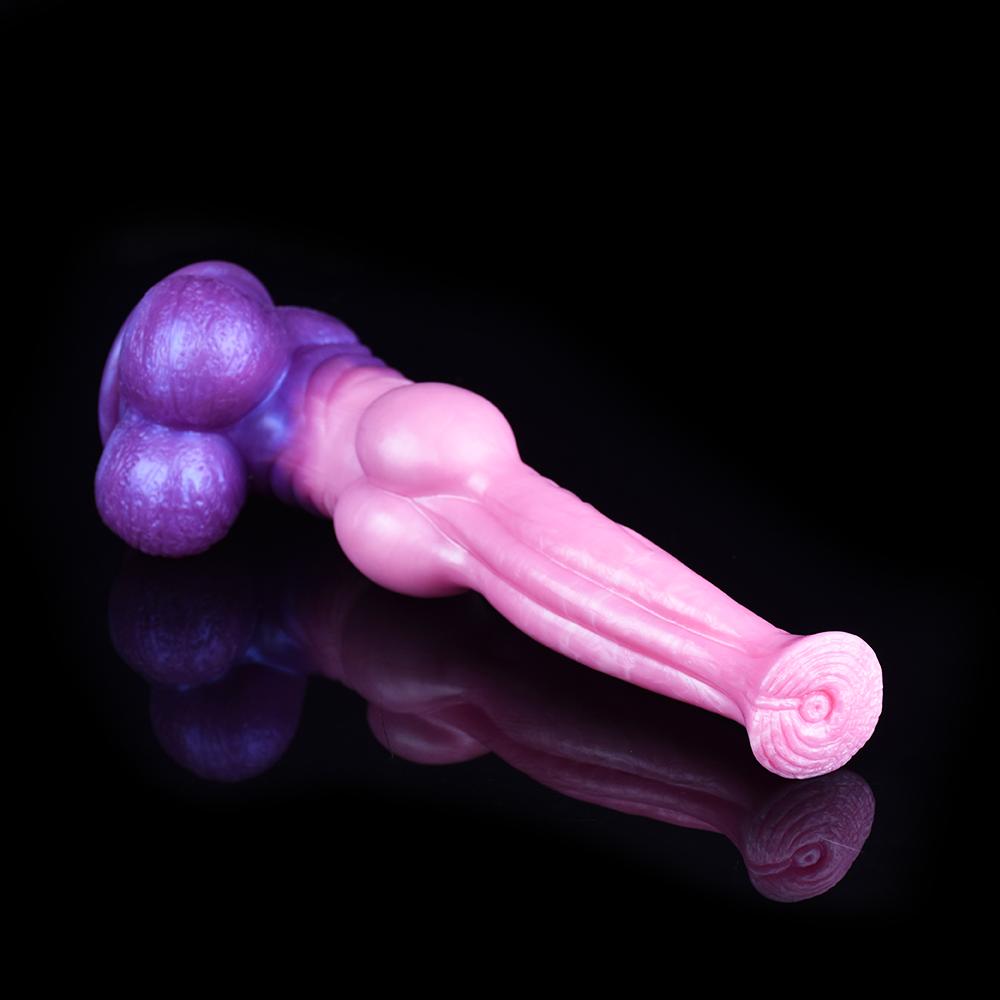 Rosa Dildo mit violettem Knoten in Draufsicht, spitz zulaufendes Ende sichtbar