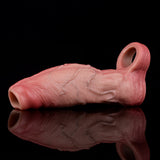 Realistic pink cock sleeve with hollow opening at one end, textured surface