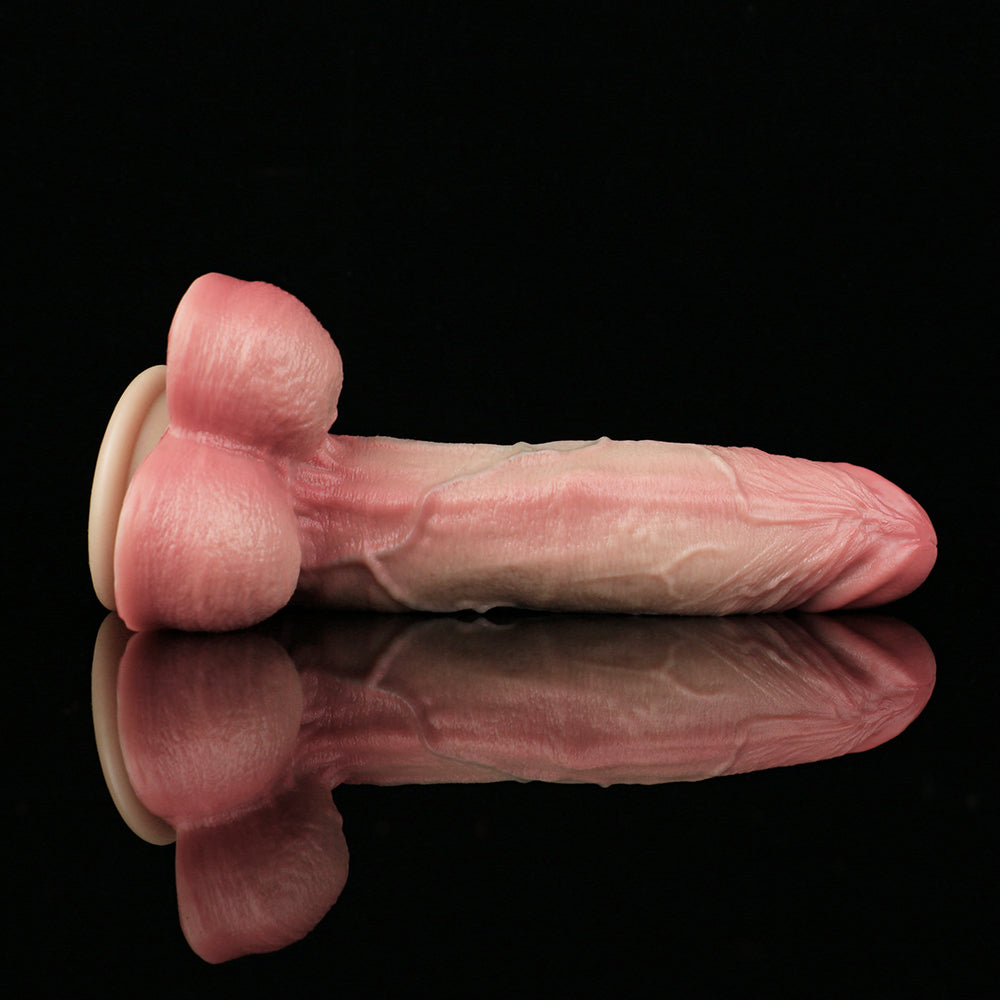 Realistic pink penis dildo with suction base; front view showing bulb and base.