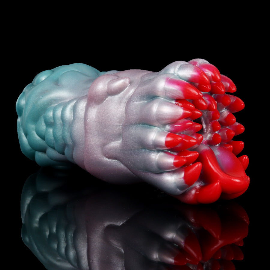 Male masturbator fleshlight with flared red nibs and blue-pink ridged body