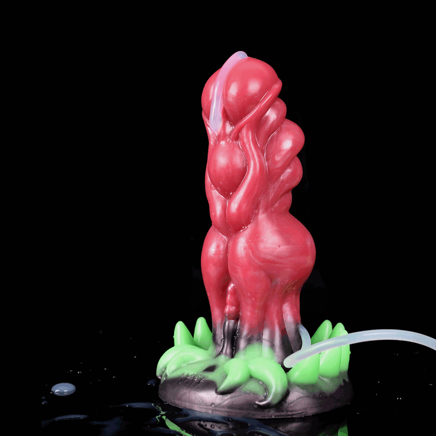 Adult novelty dildo with glossy red alien shape and green claw-like base