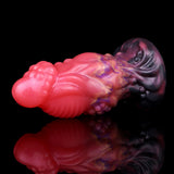Side view of pink alien anal plug with dark flared base and multicolor galaxy marbling