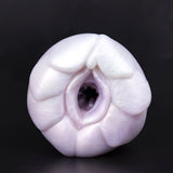 FTM dragon stroker sleeve, white pastel silicone with central opening and molded ridges