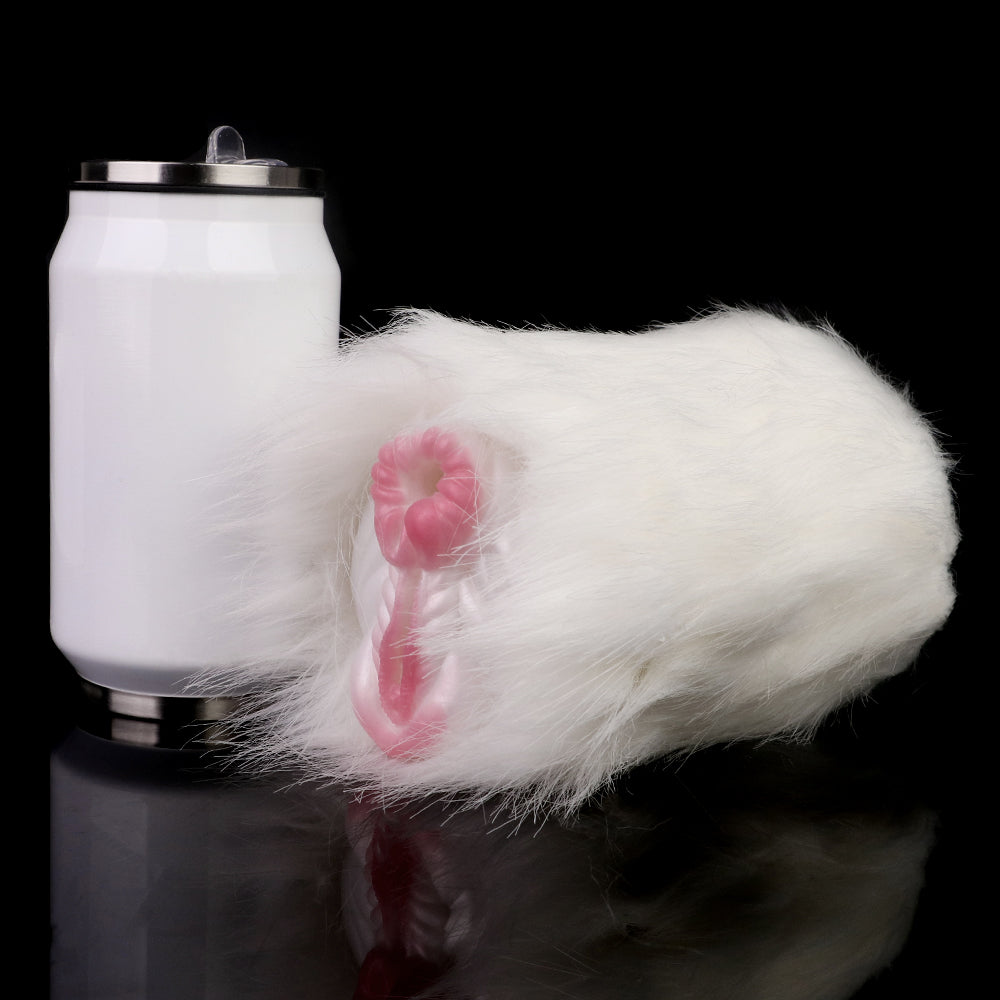 White faux-fur dual-hole fleshlight with pink openings beside bottle