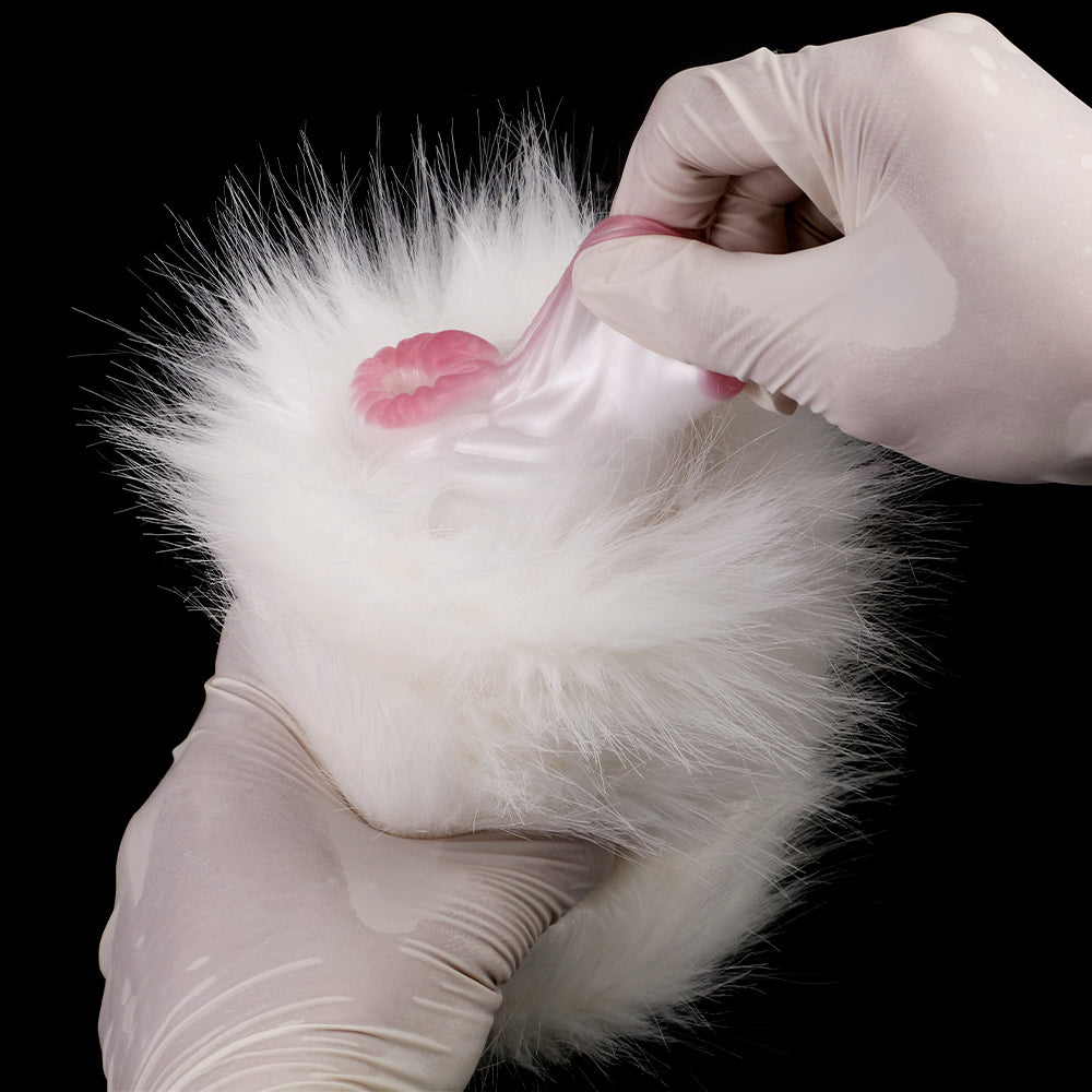 White faux-fur dual-hole masturbator with pink inner opening, open end