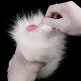 White faux-fur dual-hole masturbator with pink inner opening, open end
