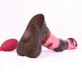 Lying side view of Arion dildo, black and pink marbled body with textured base