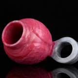 Pink enlargement sleeve with circular opening and translucent ring attachment, side view.