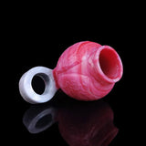 Pink cock ring with curved translucent base ring and a circular side opening.