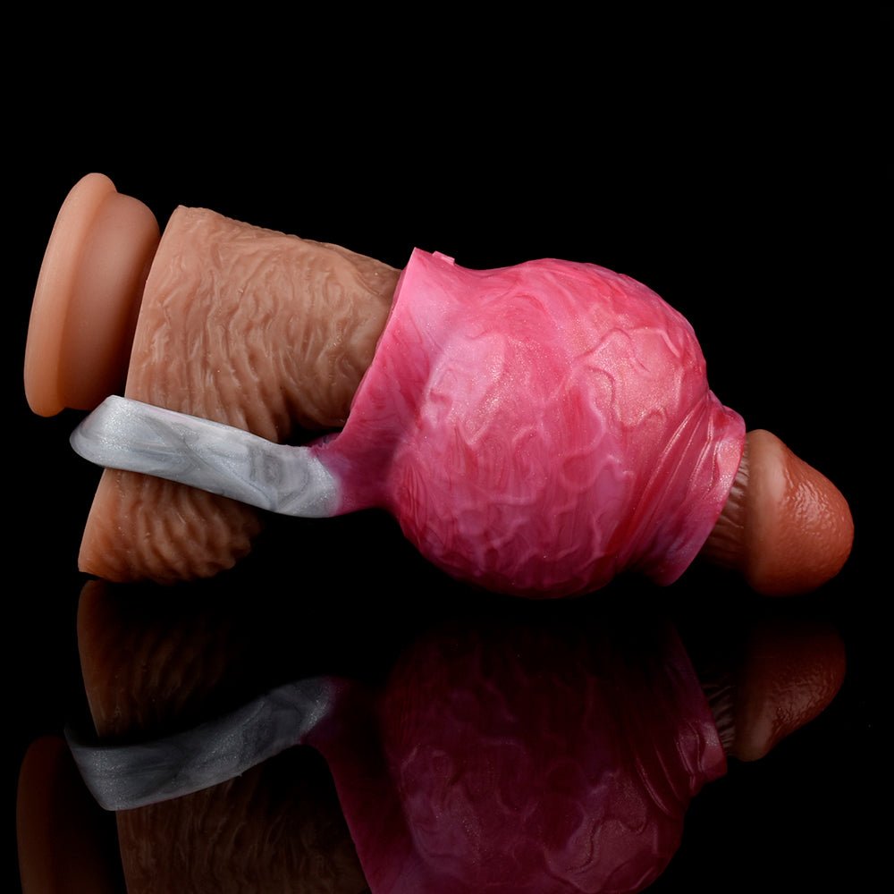 Pink enlargement sleeve on a dark-brown base with translucent strap ring, side view.
