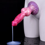 Pink dog-shaped dildo with purple knot base; clear fluid stream from tube