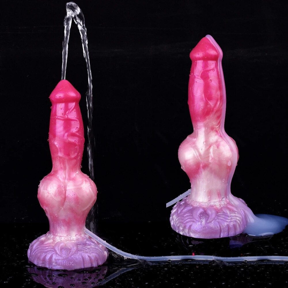 Two pink dog-shaped dildo toys with purple knot bases and tubes spraying clear streams