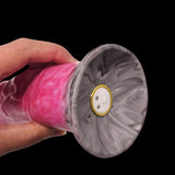 Close-up of flared base front with button detail on pink marbled vibrator
