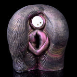Front view of animal-style dual-opening sex toy with small white control circle