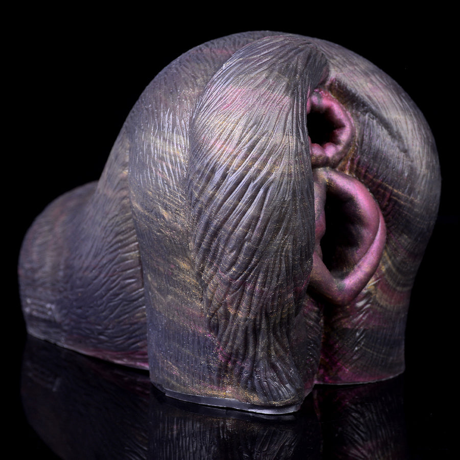 Grey animal-themed dual-hole masturbator with oval purple opening and slit detail