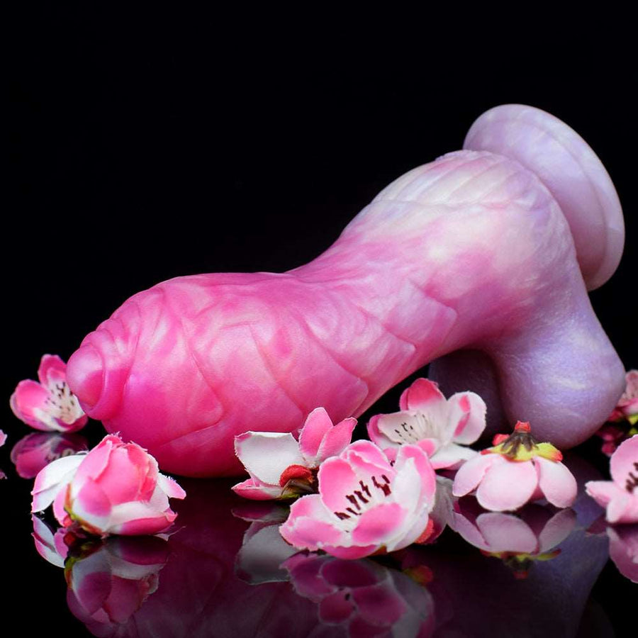 Curved unicorn butt plug in pink and lilac swirls with pink blossoms