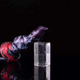 Knot dildo splashed with water droplets, purple body and red base, clear tube