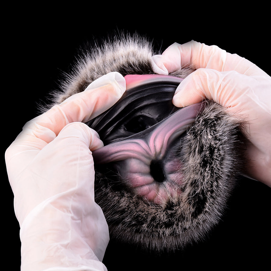 Furry dual-hole masturbator with hands adjusting dark insert inside faux-fur sleeve