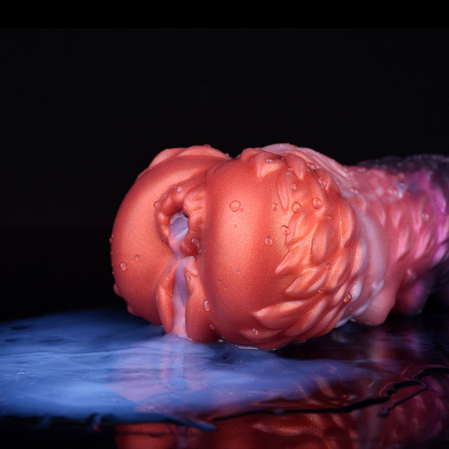 Dual-hole dragon fantasy masturbator, wet red-orange and purple texture, side view