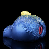 Blue sheep-shaped fantasy toy with yellow wool tuft and pink slit opening, rear close view