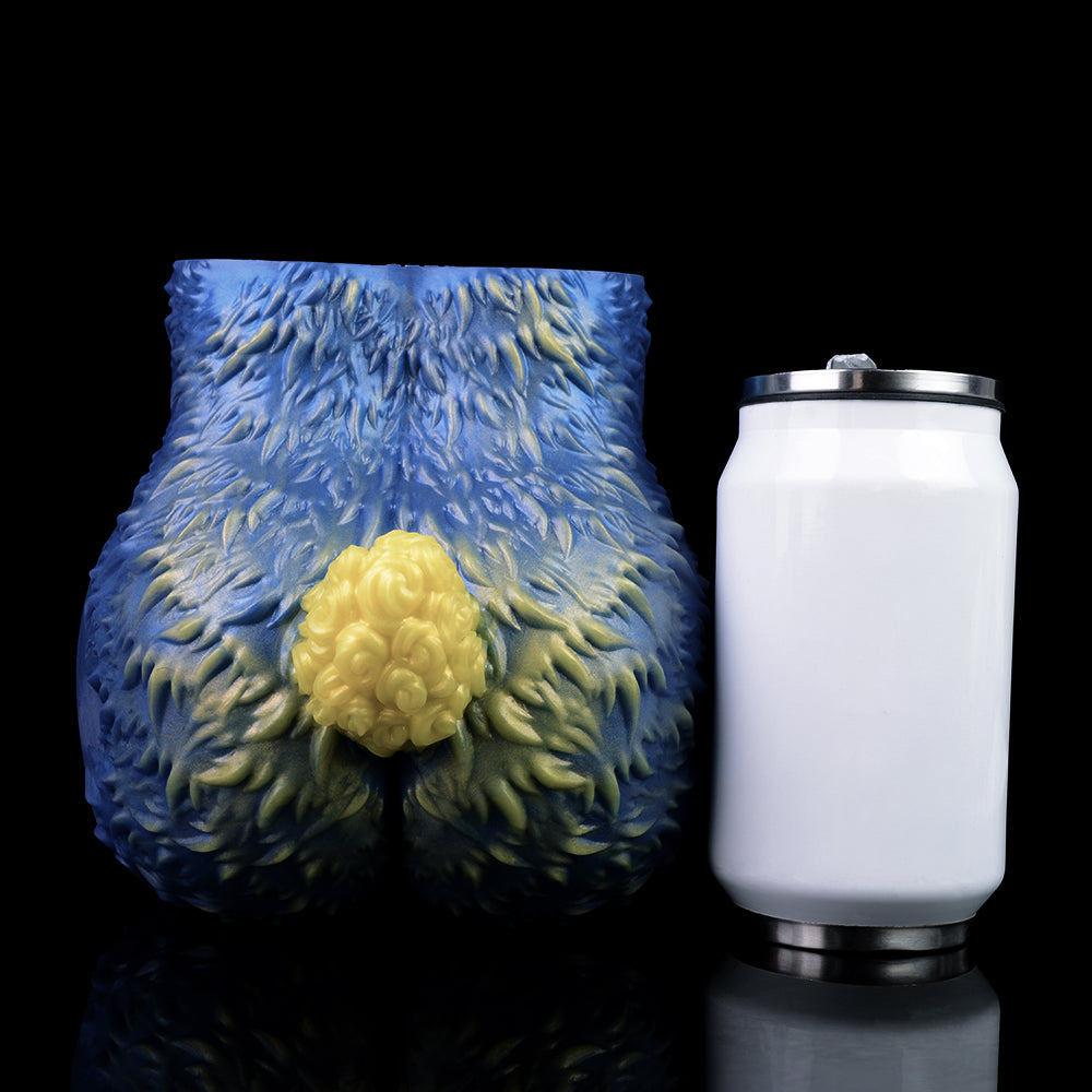 Blue sheep-shaped fantasy toy with yellow wool tuft and pink interior opening, angled view