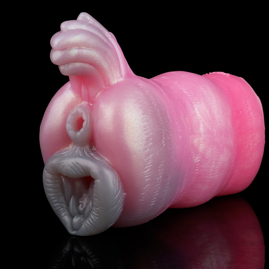 Blush pink animal-themed novelty sex toy, angled side view with raised paw-like top