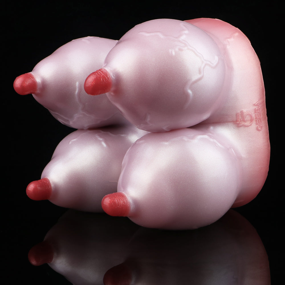 Pink silicone anatomical toy with three red-tipped tubes
