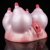 Pink silicone anatomical toy viewed from front, red inner opening