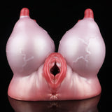 Pink silicone anatomical toy with two red-tipped forms and a central red opening
