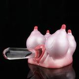 Pink silicone anatomical toy with red opening and a gray insertion tool