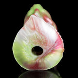 Dragon masturbator close-up, pale green teardrop head with dark round opening
