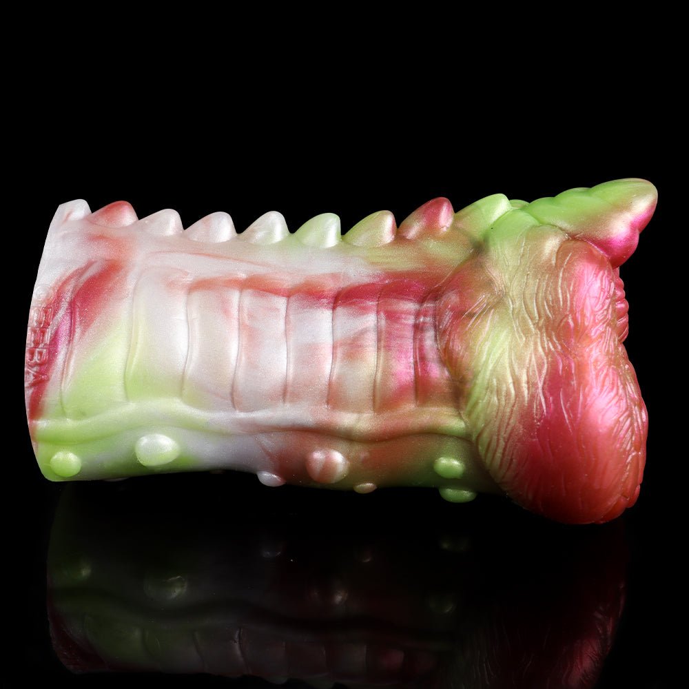 Dragon masturbator angled view, ribbed white shaft with pink-green curled dragon head